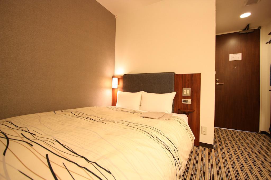 Uozu Manten Hotel Ekimae Quarto foto