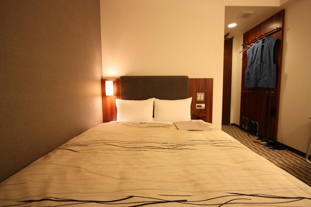 Uozu Manten Hotel Ekimae Quarto foto